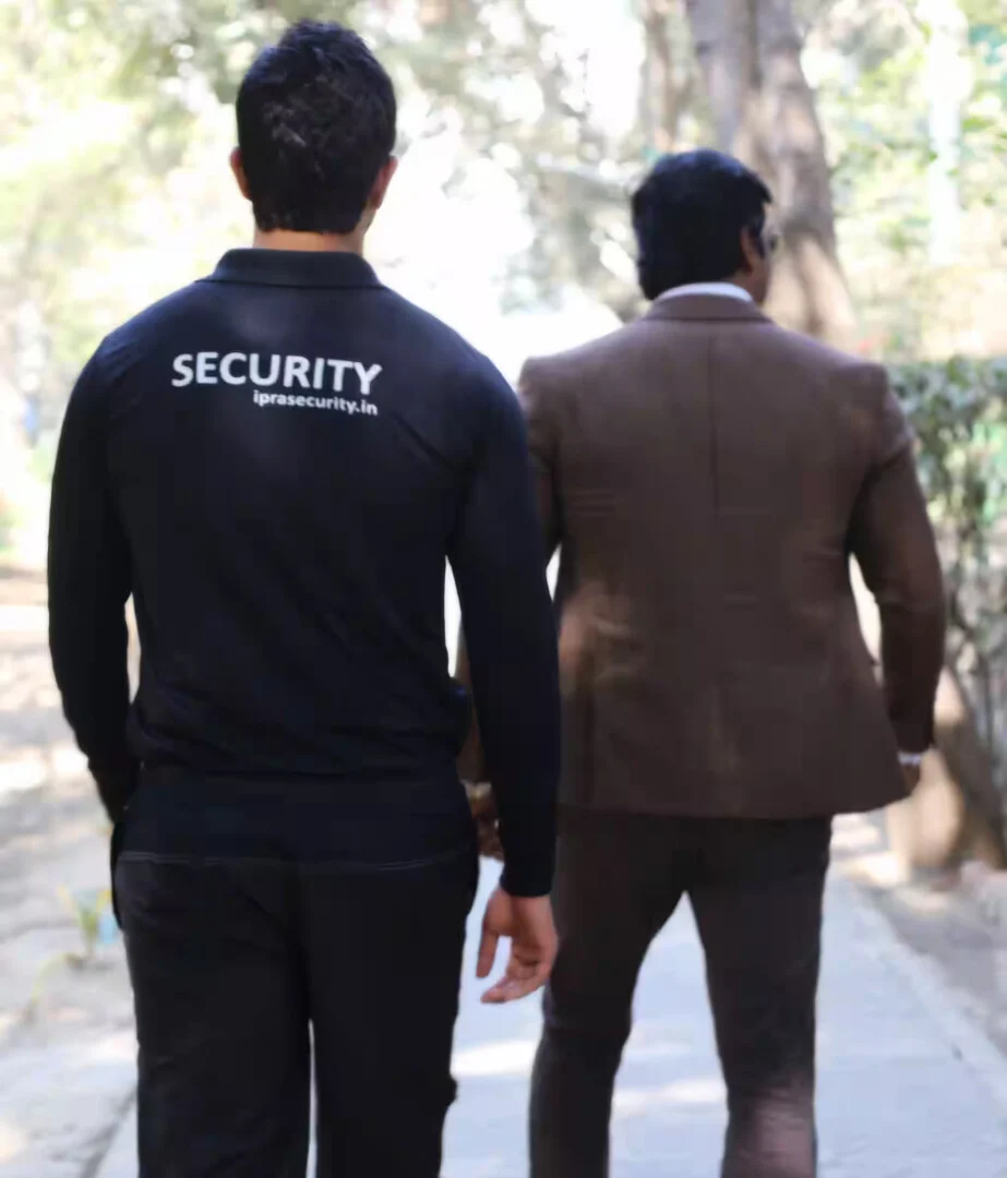 IPRA security officer escorting a client in New Delhi